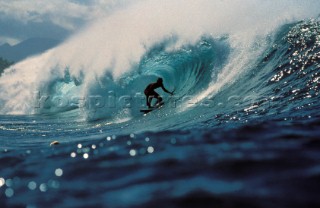 Surfer riding a tube