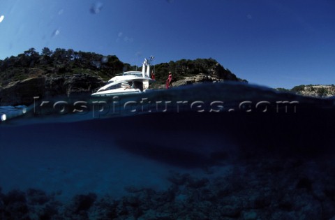 Above and below the water line with Fairline Powerboat in anchorage 
