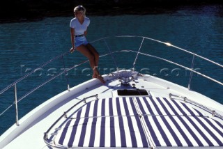 Female model on bow of Fairline powerboat