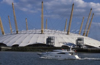 Fairline Squadron 74 passes Millenniun Dome on the river Thames in London