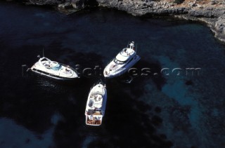 Fairline Squadron 52, Phantom 42 and Targa 43 at a secluded anchorage in clear shallow water