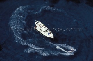 Jetski drives round a Fairline Phantom 38 at anchor