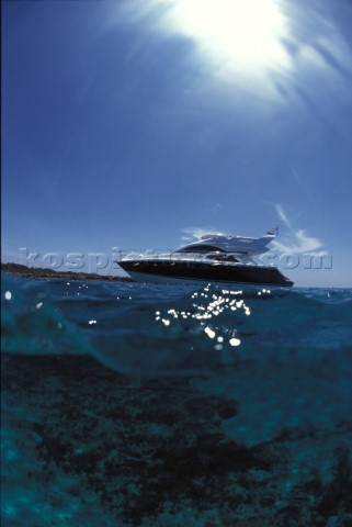 Fairline Phantom 43 at anchor in clear shallow water