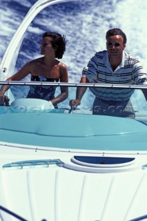 Woman and man at the helm of a Fairline Targa 34