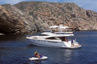 A luxurious Fairline Squadron 58 at rest in a tranquil bay in Majorca
