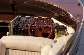 Wooden steering wheel on a classic motor boat