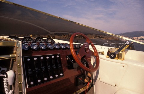 Wooden steering wheel on a classic motor launch 