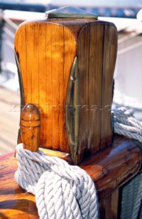 Detail of varnished wooden sampson post on a classic yacht