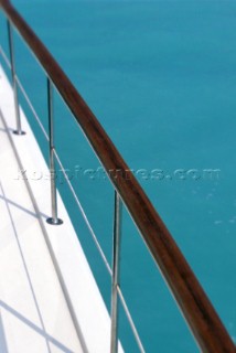 Detail of varnished hand rail on motor yacht