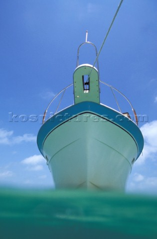 Profile of moored motor boat from surface of the water 