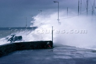 Storm waves crashing over breakwater in Punta del Este, Uraguay