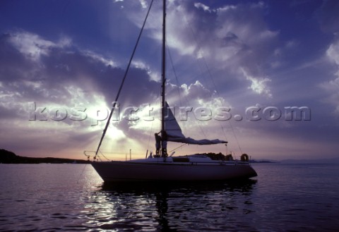 Swan 36 in secluded anchorage at sunset