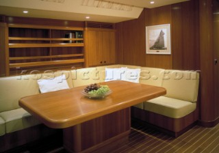 Luxury interior saloon and dining table area of a Swan 80 maxi yacht