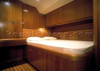 Luxury interior guest stateroom and double bed on a Swan 80 maxi yacht