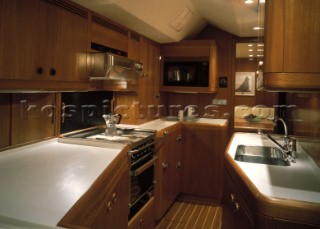 Luxury interior of galley and kitchen on a large maxi Swan yacht