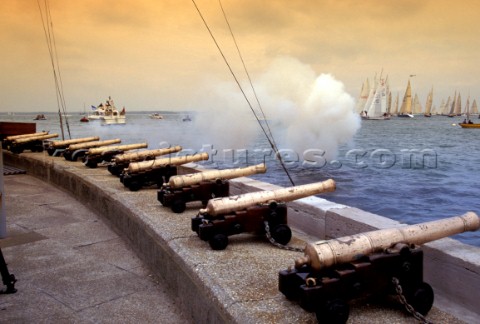Canons signal the start of racing on the platform of the Royal Yacht Squadron Cowes Isle of Wight