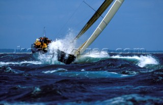 Farr 40 Dignity yacht crashing through rough seas in strong winds - Commodores Cup 2000