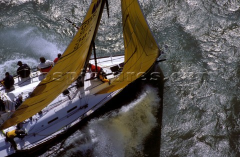 Farr 40 Dignity crashing through rough seas in strong winds  Commodores Cup 2000