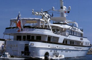 Superyacht moored alongside a quay in St Tropez harbour with tender and dinghy alongside