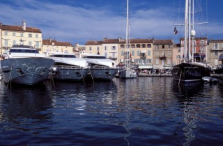 Line of moored superyachts and maxi sailing yachts in the port of St Tropez, France