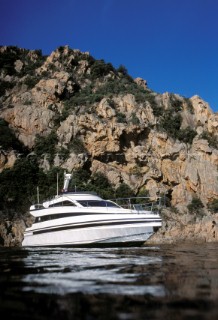 Conam 48 powerboat at anchor, moored in Corsica