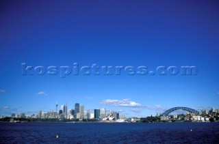 Waterside view of Sydney Harbour bridge location showing city skyline