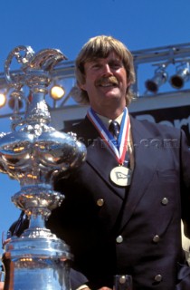 Sir Peter Blake standing with the Americas Cup after winning it in 1995