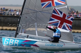 WEYMOUTH, ENGLAND - AUGUST 5th: Ben Ainslie of Great Britain wins Gold Medal in the Mens Finn sailing dinghy class at the London 2012 Olympic Games at Weymouth Harbour on August 5th, 2012 in Weymouth, England.