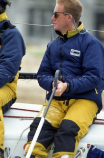 The late Charles Oxley helming Quokka. Rolex Commodores Cup 1998. The Solent, Cowes, Isle of Wight, UK. Three boat teams from around the world compete for the coveted RORC trophy. The event is hosted by the Royal Yacht Squadron.