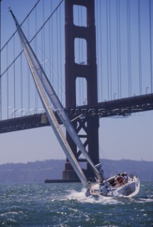Nautor Swan boat sailing in front of the Golden Gate Bridge, San Francisco, USA.