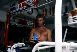 Ed Danby cooking in the galley onboard Lion New Zealand the Whitbread Round the World Race 1986 (now known as the Volvo Ocean Race)