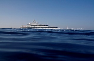 Superyacht moving across a calm sea