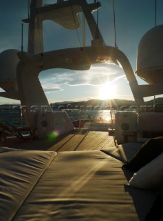 Superyacht in the Mediterranean. Navigation mast with Furnuo radar and communication aerials and satcom dishes