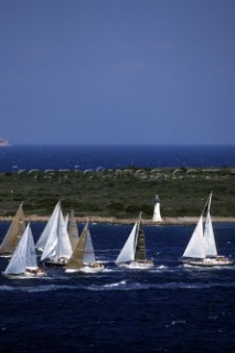 Fleet of Swan yachts racing through the Maddalena Islands off Port Cervo Sardinia during the Rolex Swan World Cup