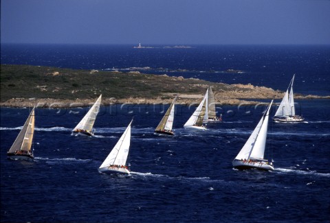 Fleet of Swan yachts racing through the Maddalena Islands off Port Cervo Sardinia during the Rolex S