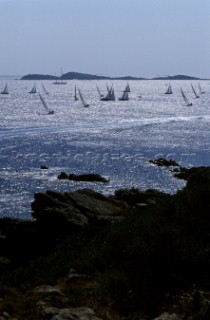 Fleet of Swan yachts racing through the Maddalena Islands off Port Cervo Sardinia during the Rolex Swan World Cup