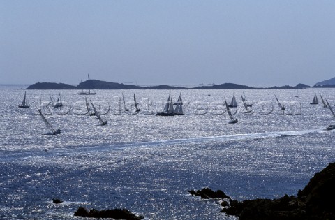 Fleet of Swan yachts racing through the Maddalena Islands off Port Cervo Sardinia during the Rolex S