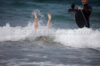 Body Boarding in the surf on the beach in St Ives in Cornwall, UK.