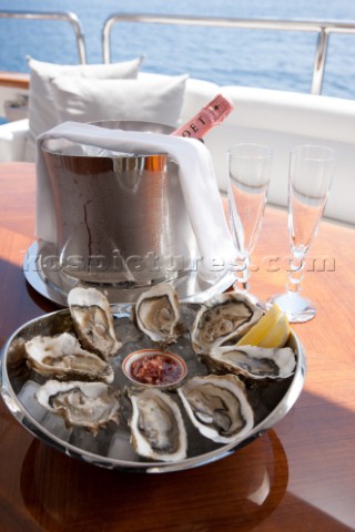 Champagne and oysters onboard a superyacht