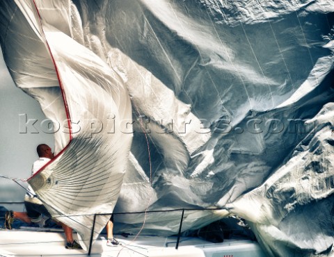 Bowman grabs the spinnaker on a drop on a TP52 during the Audi MedCup in Marseilles