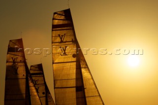LOUIS VUITTON TROPHY, DUBAI, UNITED ARAB EMIRATES, NOVEMBER 20TH 2010: Sails of the IACC yachts at sunset. Louis Vuitton Trophy in Dubai (12 - 27 November 2010).