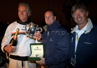 Mike Slade, owner of ICAP LEOPARD, line honours, receives a Rolex Yacht-Master Timepiece & Erroll Bruce Cup trophy