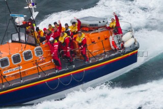Rambler 100, Sail n: USA25555, Class: IRC CK, Division: IRC, Owner: George David, Type: JK 100.  George Davids RAMBLER100 capsized and the crew being rescued by the Baltimore RNLI lifeboat.  Rolex Fastnet Race 2011.