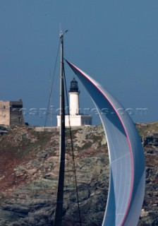 Yachts rounding the Giraglia Rock Lighthouse on the island in the Mediterranean
