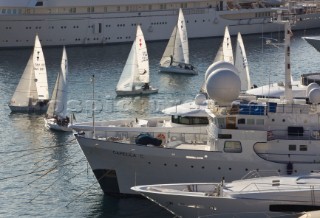 Superyachts moored in Monaco harbour port with yachts sailing
