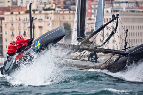 Naples Italy 11042012  Americas Cup World Series Naples 2012  Artemis Racing leaps from a wave on Da