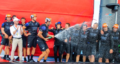 191220  Auckland NZL36th Americas Cup presented by PradaRace Day 3Mike Lee sprays champagne as Emira