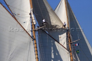 Les Voiles de Saint-Tropez 2011 - crew climb the masts to set the fisherman sail