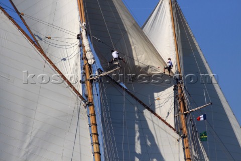 Les Voiles de SaintTropez 2011  crew climb the masts to set the fisherman sail