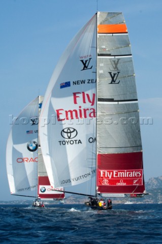 Down the final run the Louis Vuitton Umpire boat penalises Emirates Team New Zealand for the back st